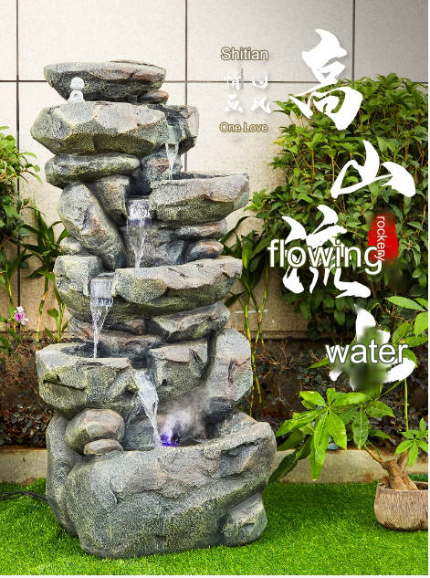 A faux stone rockery fountain with flowing water, symbolizing prosperity, suitable for outdoor garden, courtyard, balcony landscape decoration with a circulating water pool.