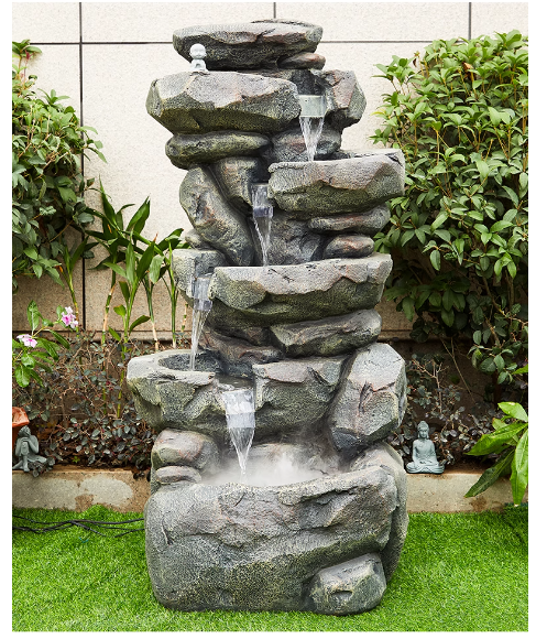 A faux stone rockery fountain with flowing water, symbolizing prosperity, suitable for outdoor garden, courtyard, balcony landscape decoration with a circulating water pool.