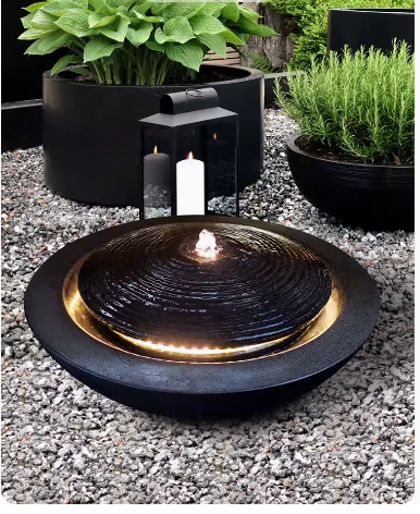 Garden water fountain feature, modern and simple home decoration, brings wealth and prosperity, crafted from decorative stones, resembling a treasure basin.