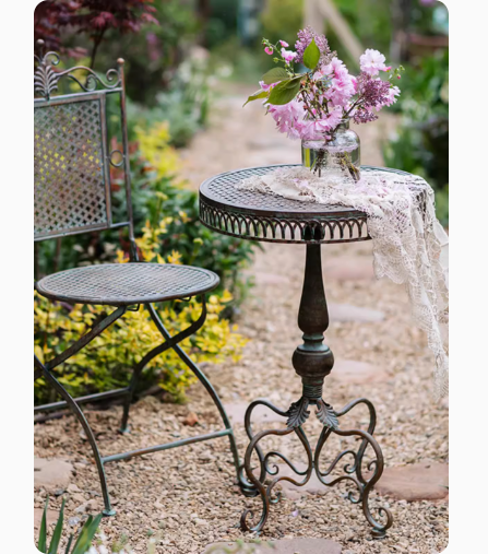 European Retro Iron Courtyard Table and Chairs, crafted from wrought iron, ideal for a cozy garden or terrace. This set is perfect for leisure and relaxation, creating a charming outdoor ambiance.