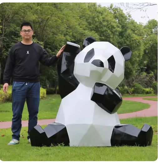 Fiberglass painted panda sculpture, outdoor lawn decoration with geometric animal design.