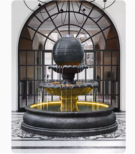 This outdoor courtyard fish pond features a large European-style round water fountain sculpture that doubles as a humidifier and floor decoration.